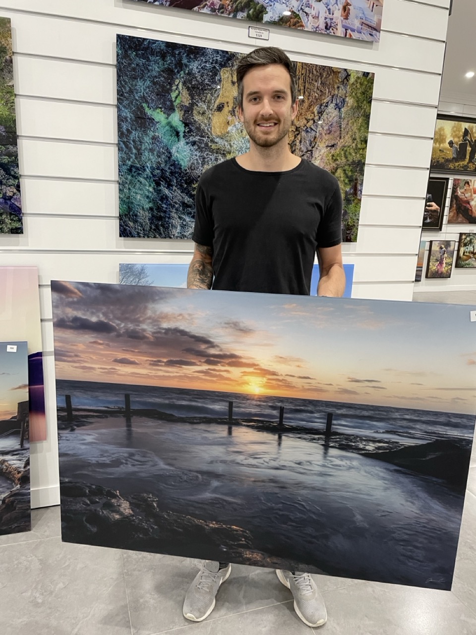 James Cole with a large finished print at an exhibition