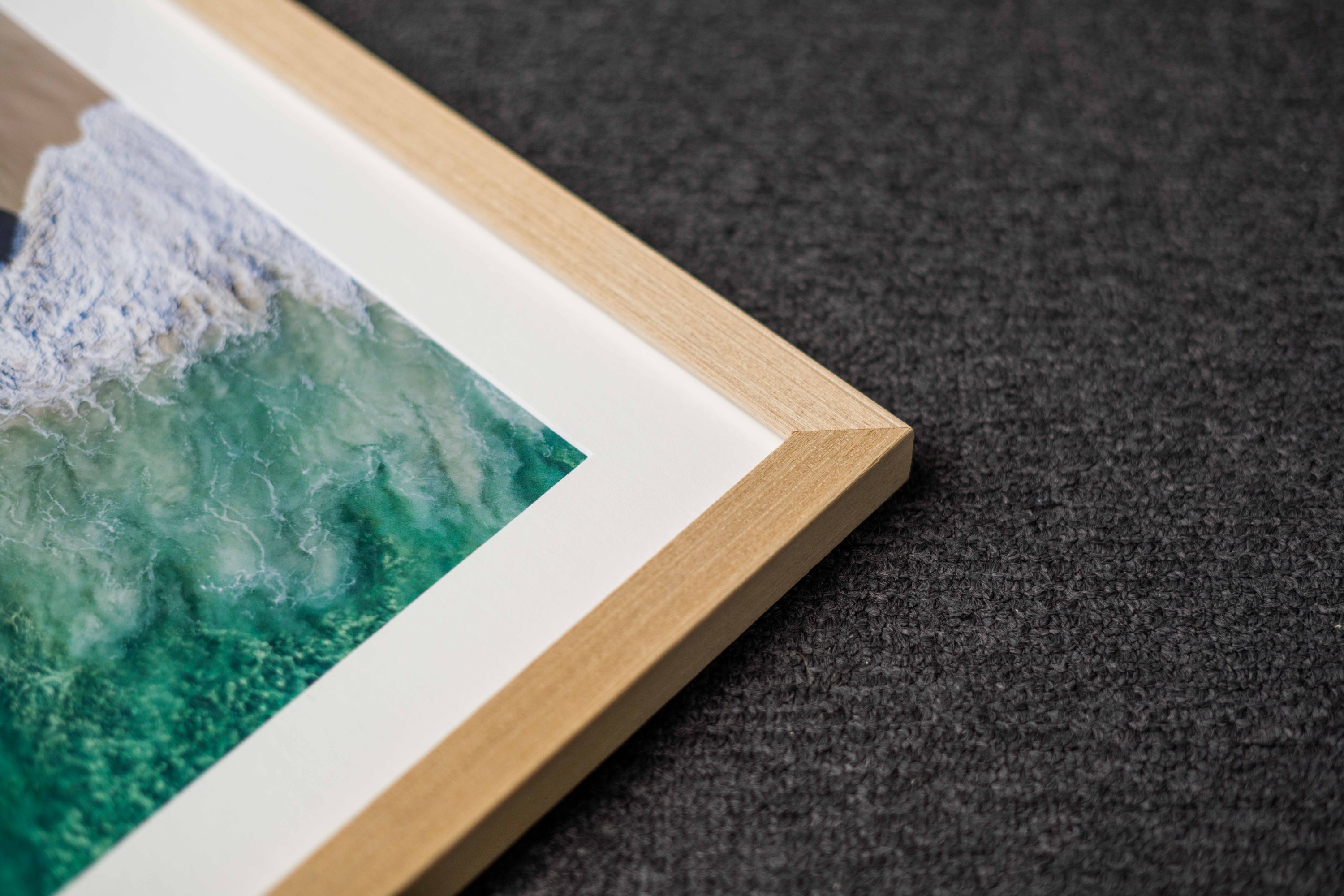 A close-up of an oak timber frame corner on a finished print